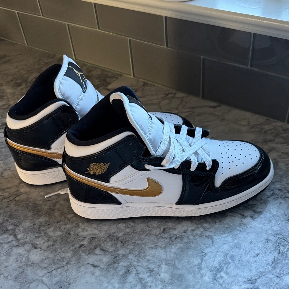 Gold black and white Jordan Air Force Ones. Great condition. Big Boys 6.5y